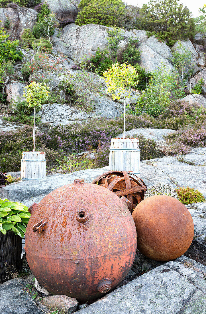 Rusted decoration in the rock garden
