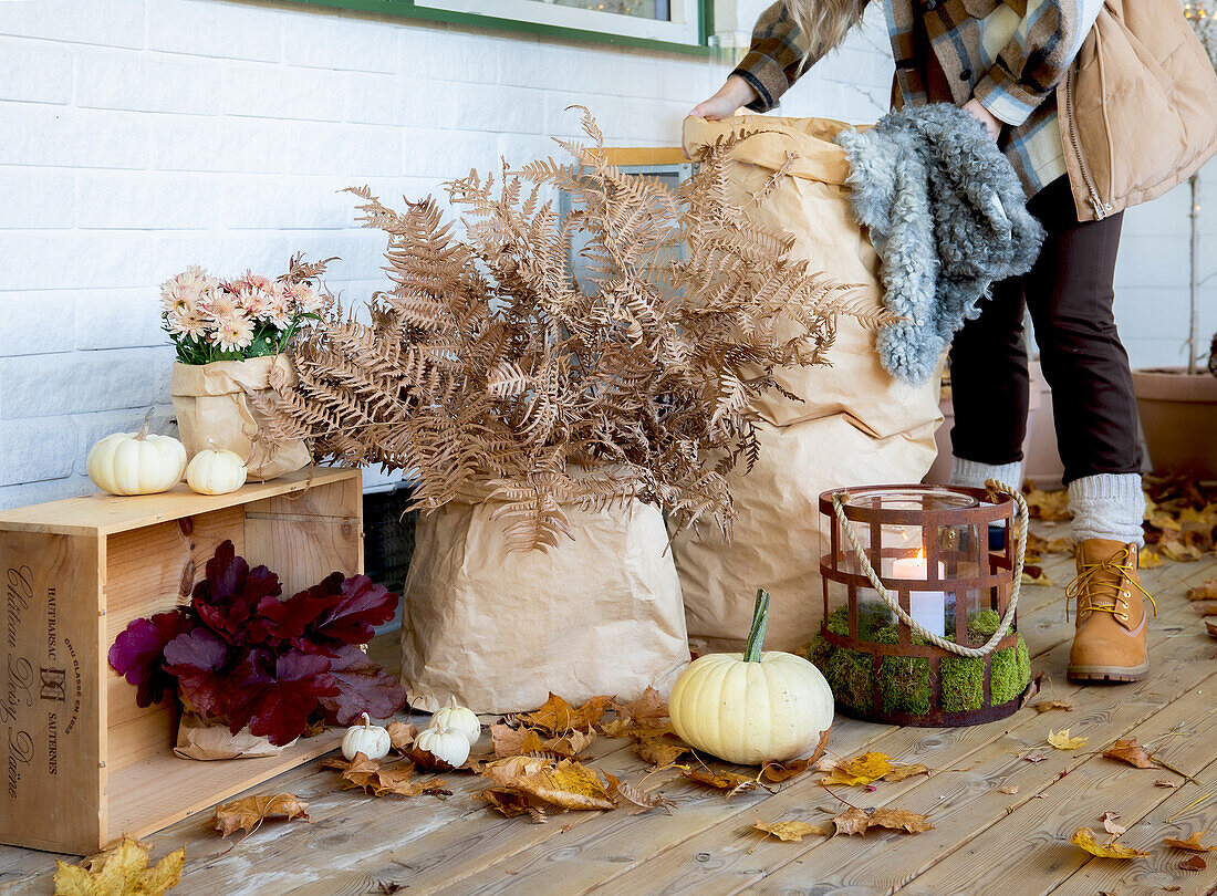 Coarse brown paper bags as planters on autumn porch