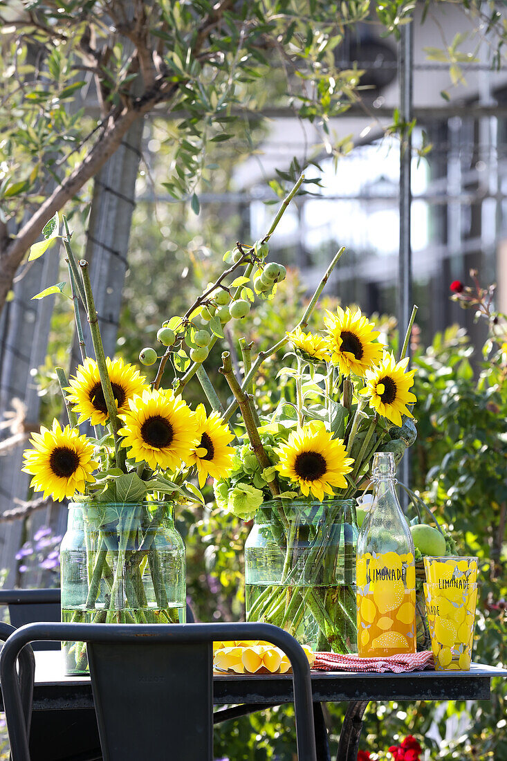 Sunflowers in large glass jars