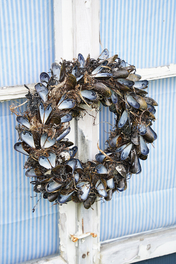 Wreath made from mussel shells on a window