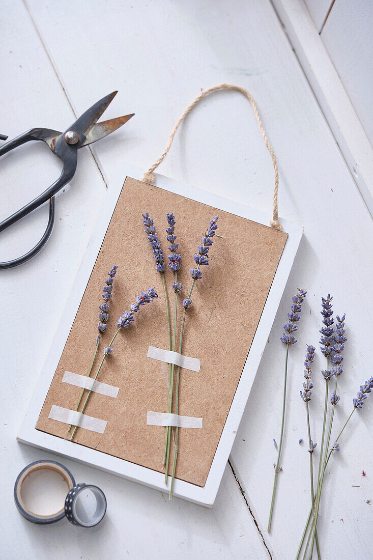Preparing photo frame with dried flowers