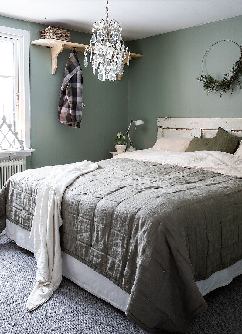 Bedroom with rustic charm and crystal chandelier