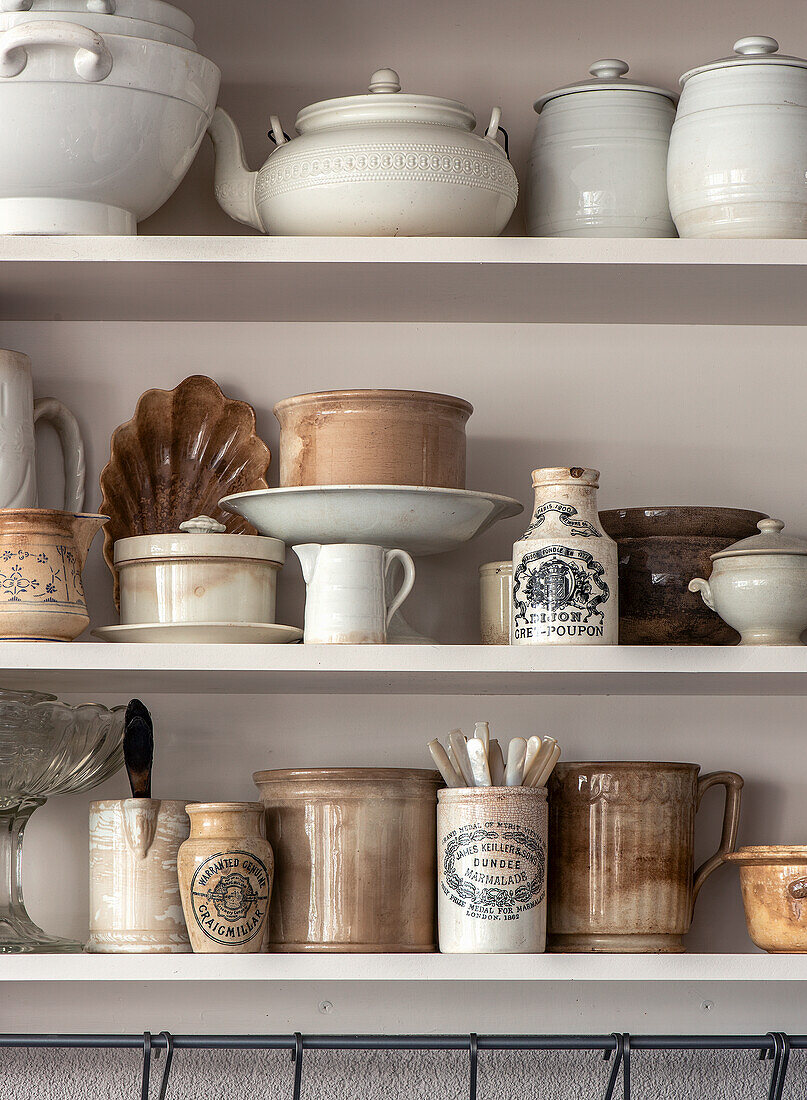 Shelf with vintage kitchen utensils and storage containers