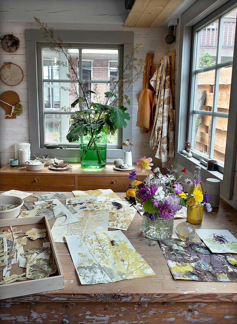 Creative work area with plants and art materials