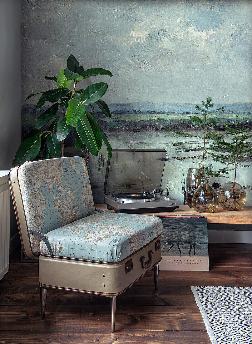 Reading corner with suitcase chair, record player and various plants