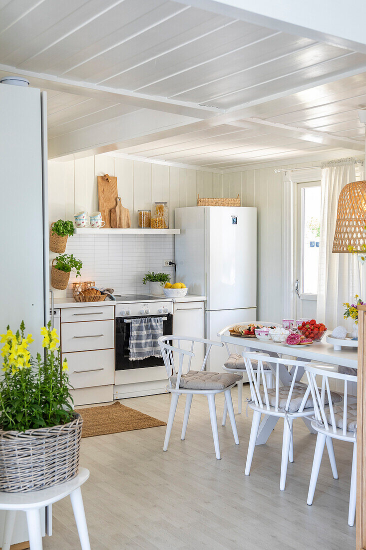 Bright kitchen with white wood paneling