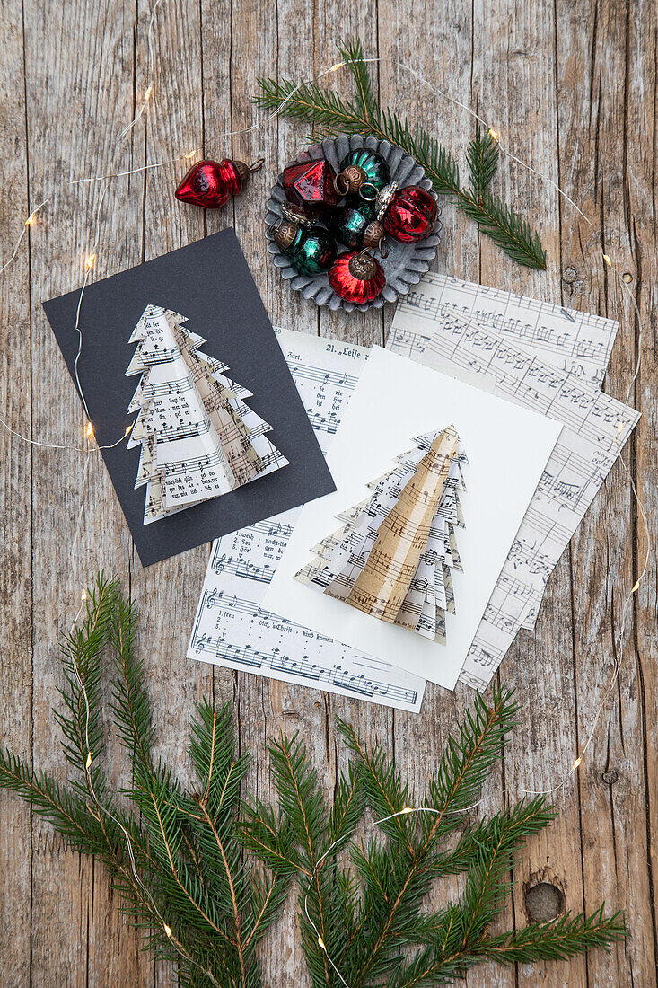 DIY Christmas cards with sheet music fir tree surrounded by fir branches