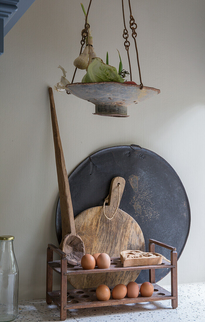 Vintage kitchen accessories with eggs, wooden spoon and chopping board