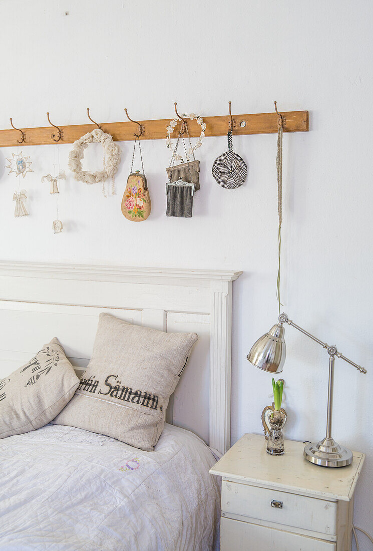 Bedroom with rustic wall hook board and decorative accessories