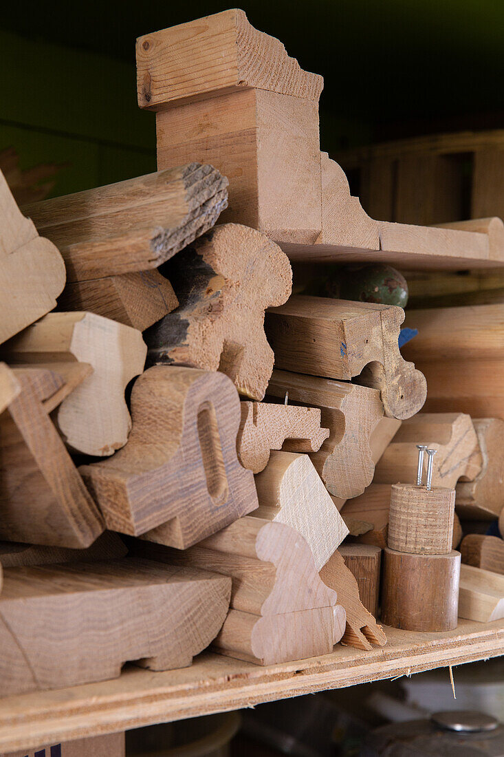 Stack of wooden components and wood scraps in a workshop