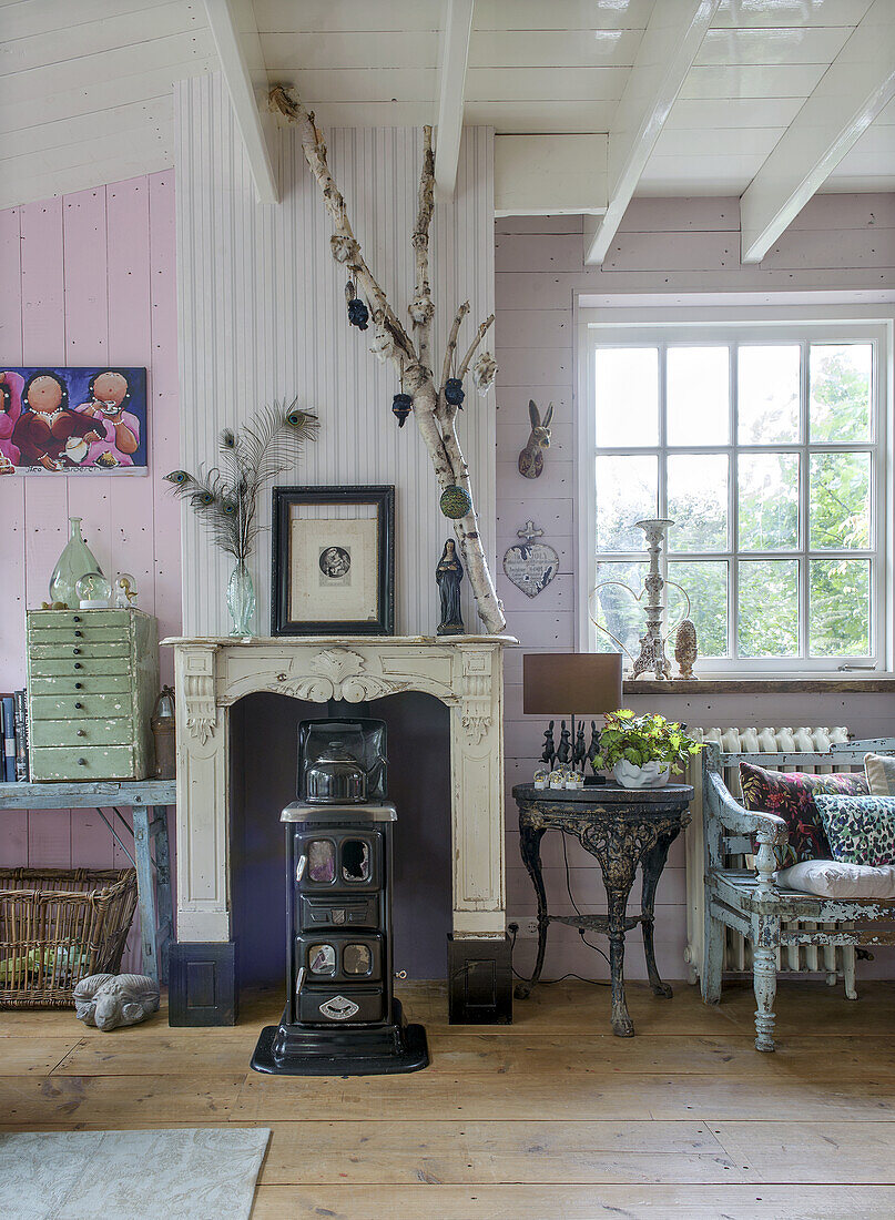 Vintage living room with rustic fireplace, wooden floor and nostalgic decoration