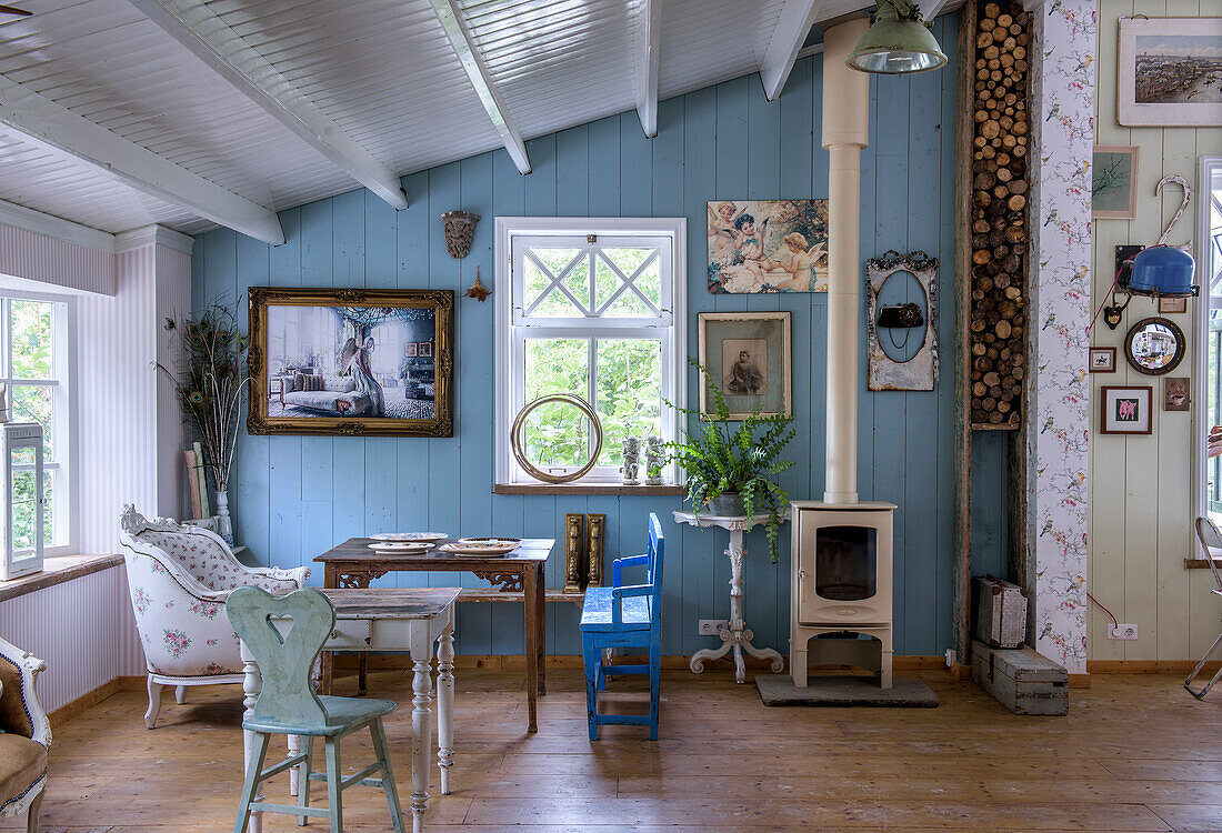 Country-style room with wood stove and blue wall