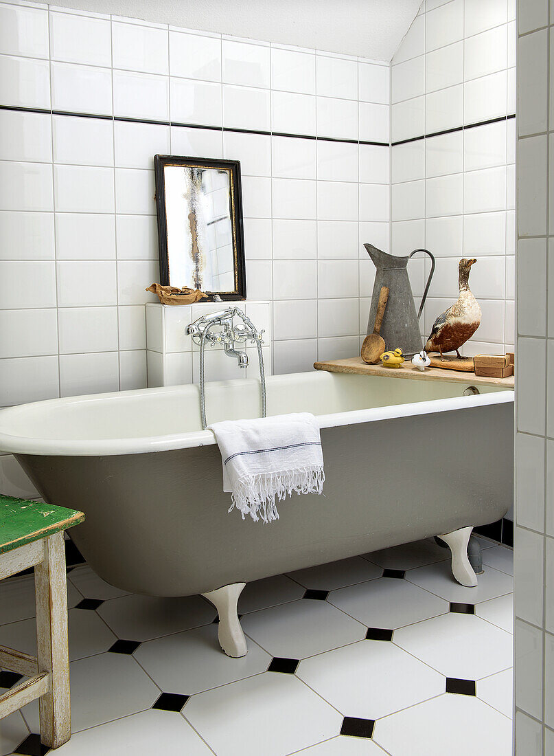 Freestanding bathtub in bathroom with retro charm