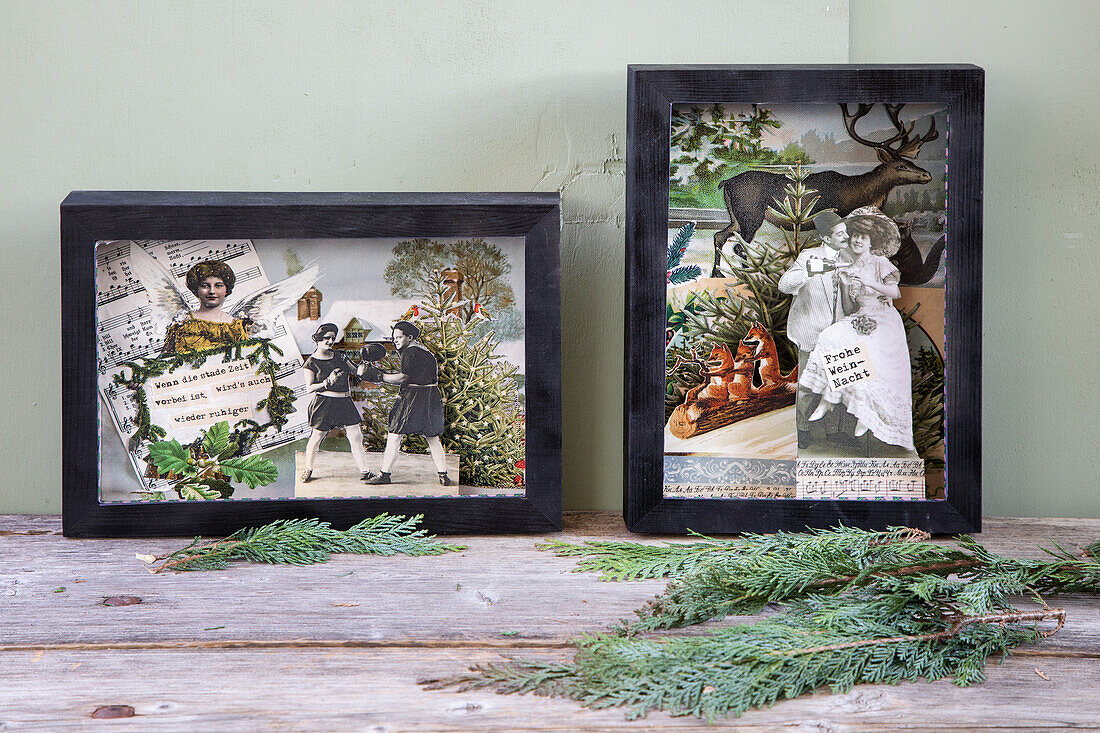 Collages with vintage motifs in a black frame on a wooden table with fir branches