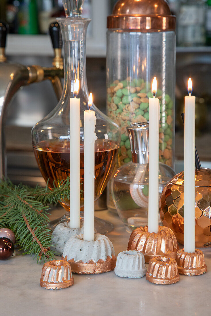 Decorative candles in concrete and copper candle holders