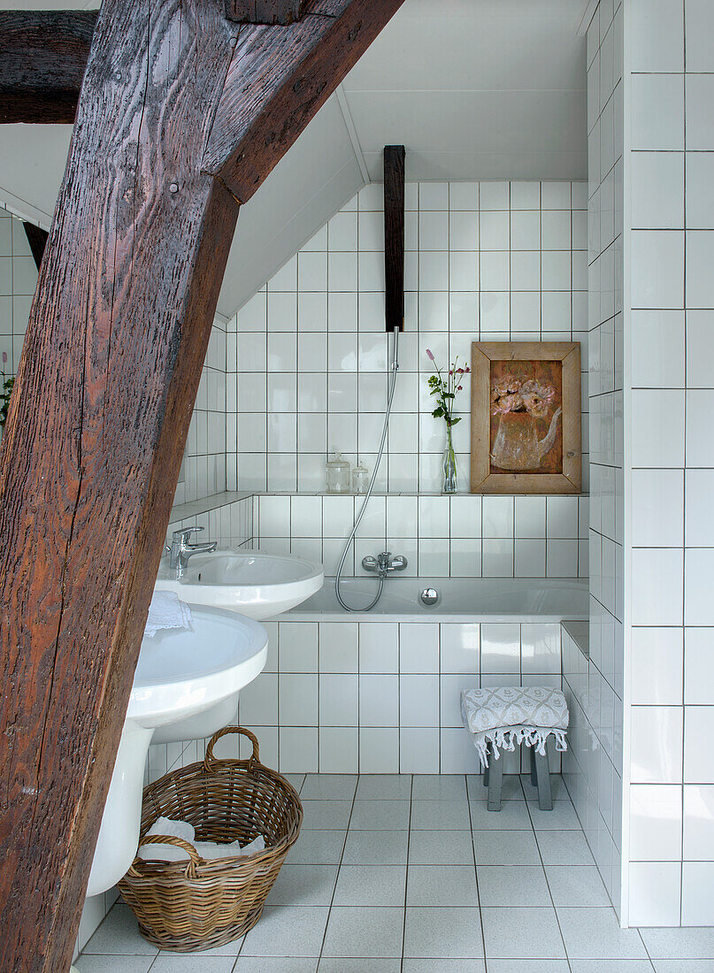 Bathroom with exposed wooden beams and tiled walls