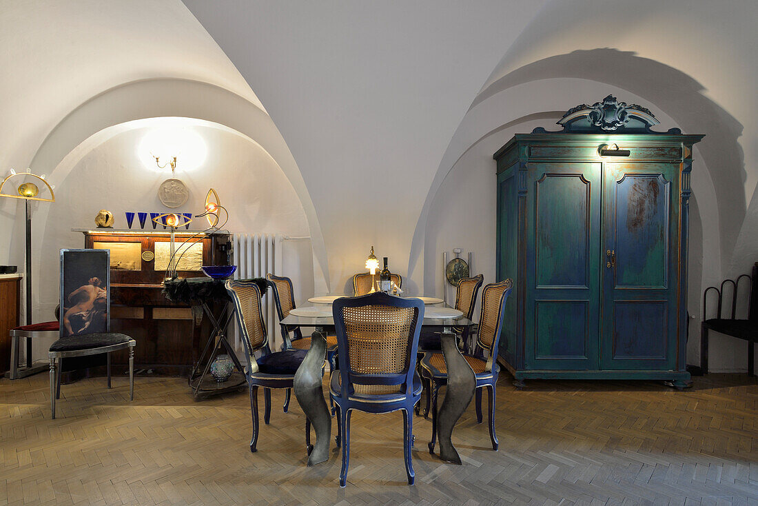 Dining room with vaulted ceiling and antique wooden cupboard