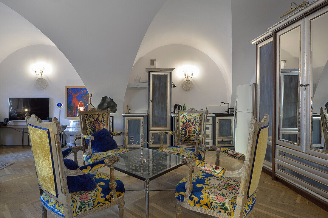 Dining room with vaulted ceilings and antique chairs