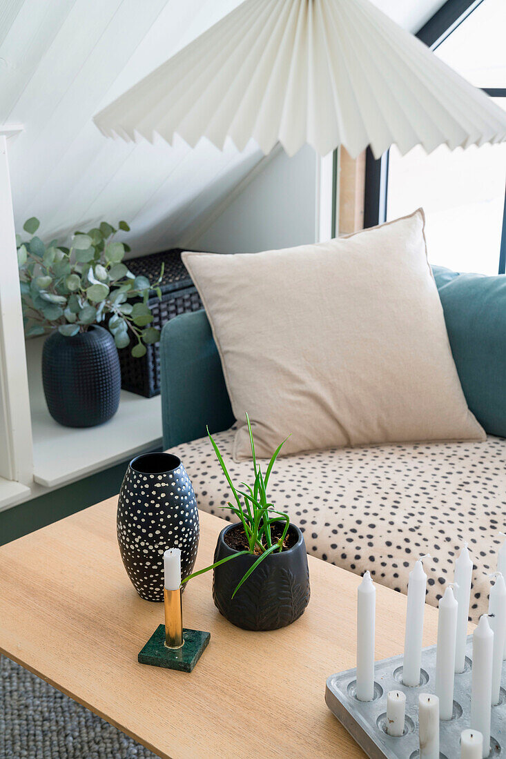 Living room with eucalyptus branches, dot vase and modern candlestick