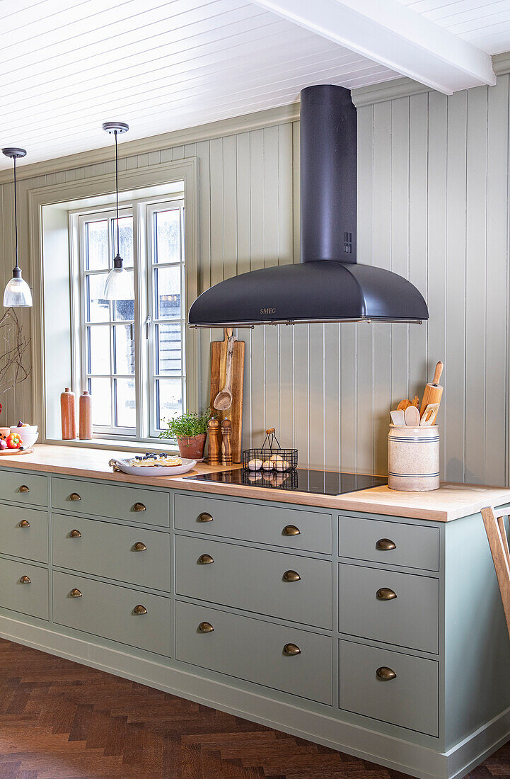 Modern country-style kitchen unit and black extractor hood