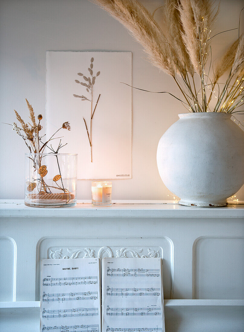 Decorative still life with pampas grass and dried flowers on a white piano