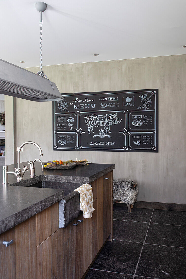 Modern kitchen with large blackboard