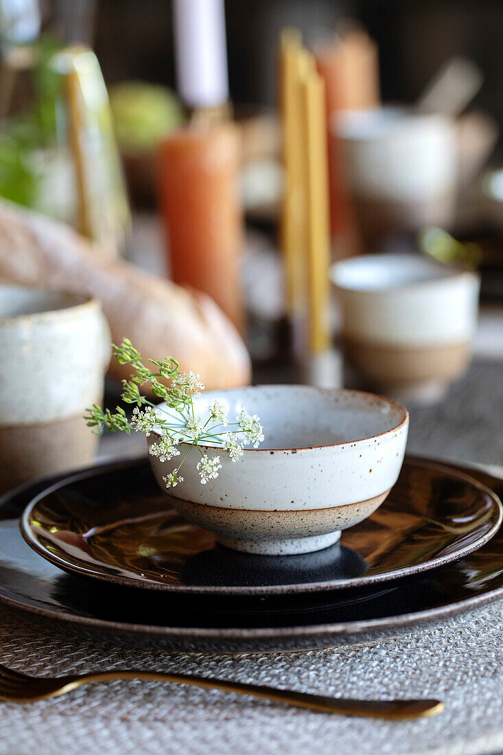 Ceramic crockery with delicate flowers on a table setting