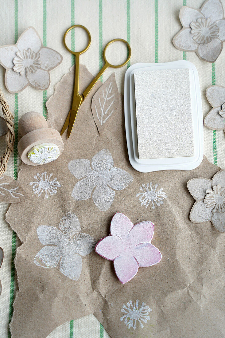 DIY flower stamps, scissors, ink pad and wrapping paper