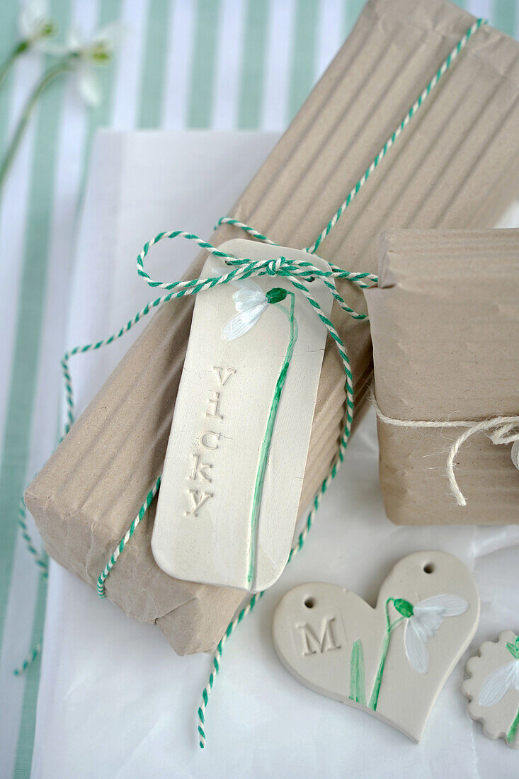 Wrapped gifts with personalised clay tags