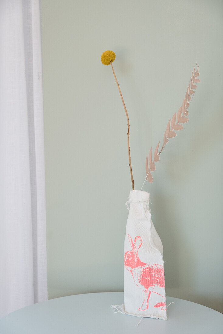 Dried flowers in DIY vase with bunny motif