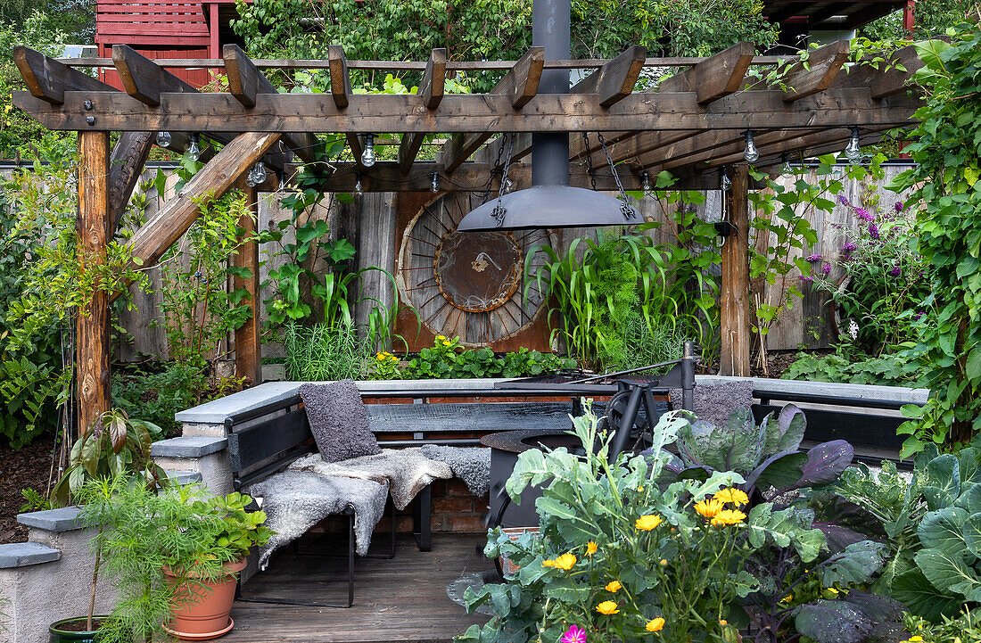 Cosy gazebo with wooden pergola and lush plant decoration