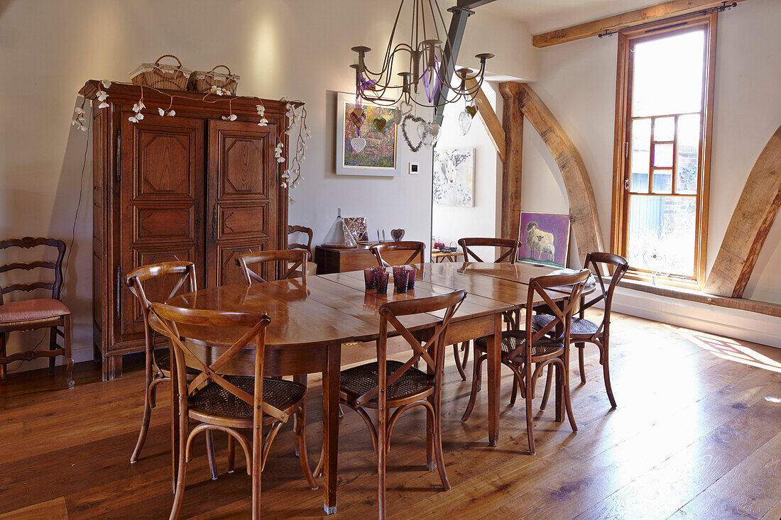 Dining area with wooden furniture in a converted barn