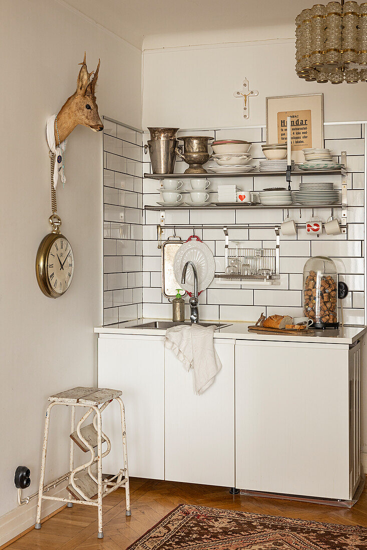 Kitchen with open shelving and wall tiles