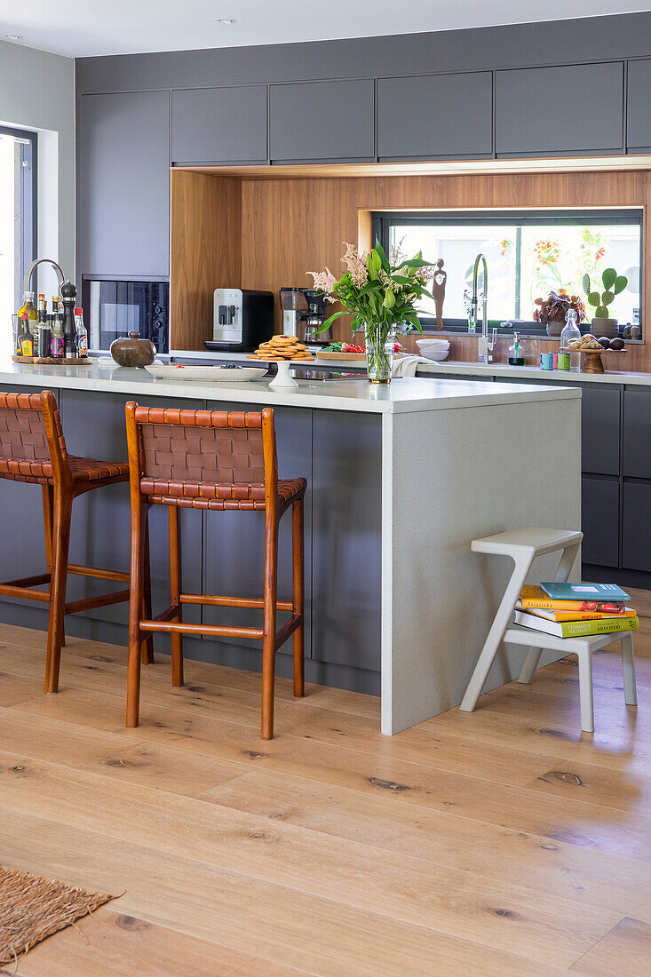 Modern kitchen with kitchen island and bar stools