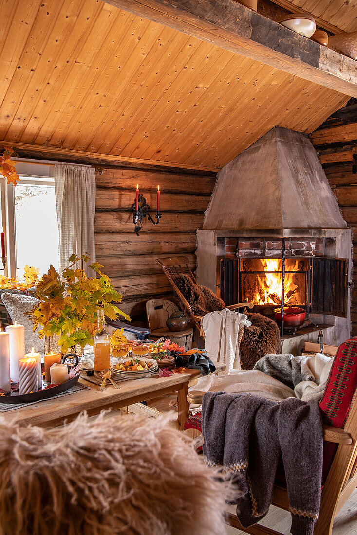 Rustic living room with fireplace and autumnal decorations