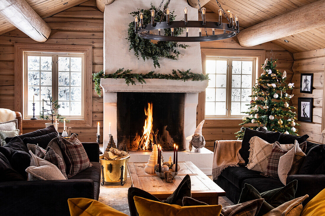 Rustic living room with open fireplace and Christmas decorations