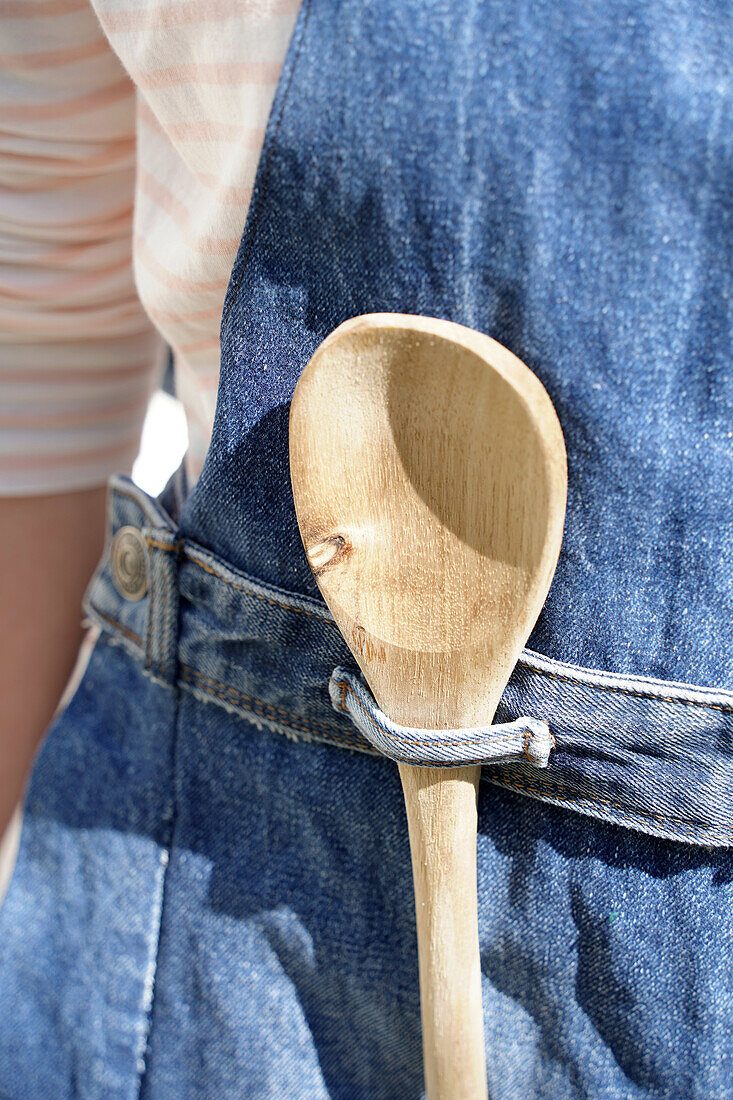 Denim apron with wooden spoon