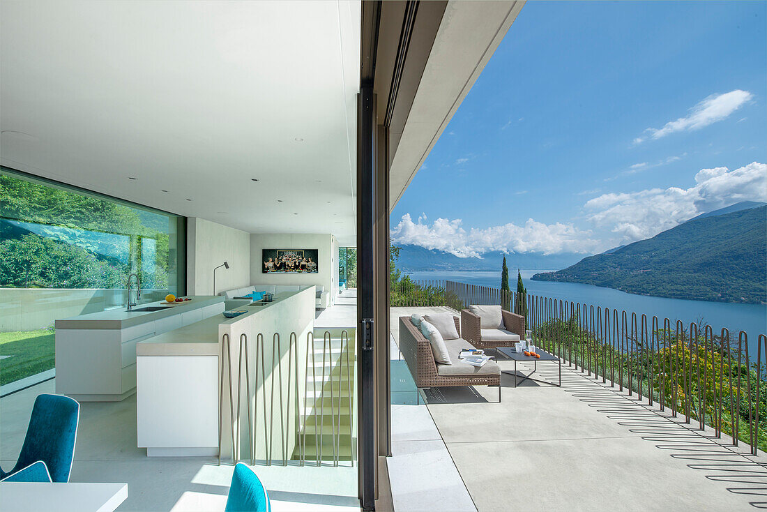 Modern kitchen with views of the terrace and lake