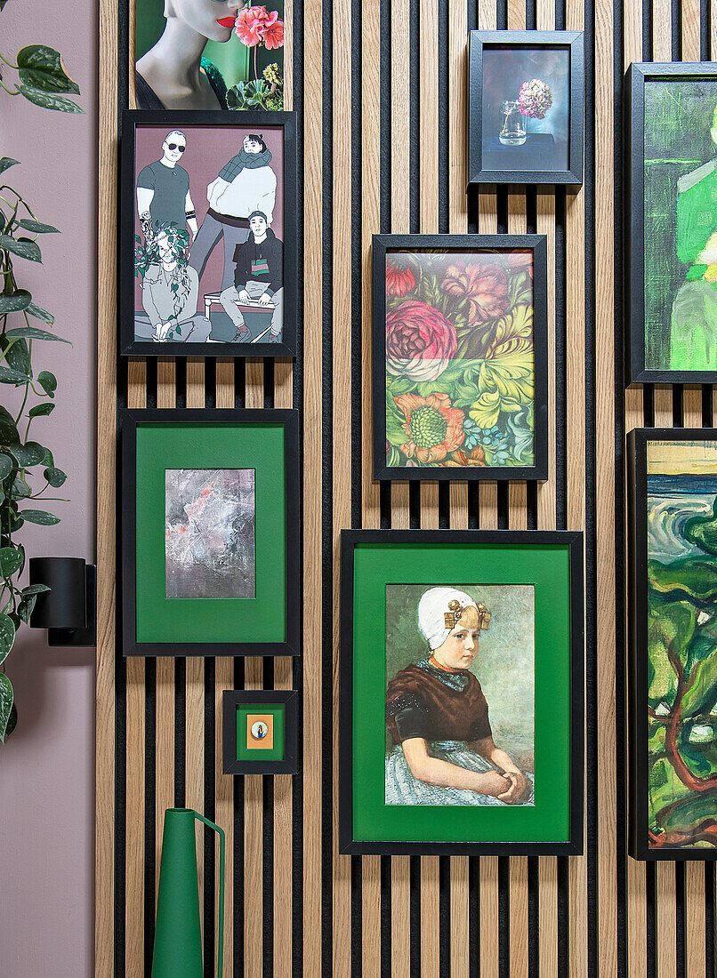 Framed artwork on a wooden slatted wall