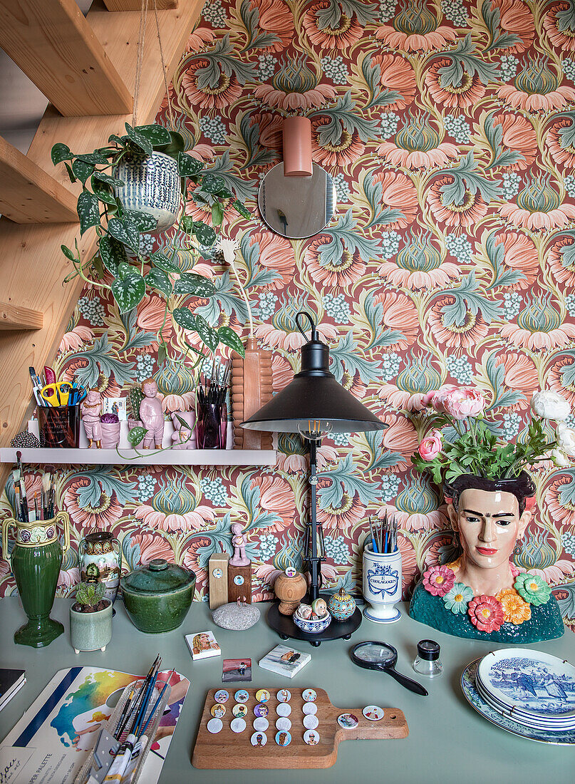 Creative workspace, patterned wallpaper and plants