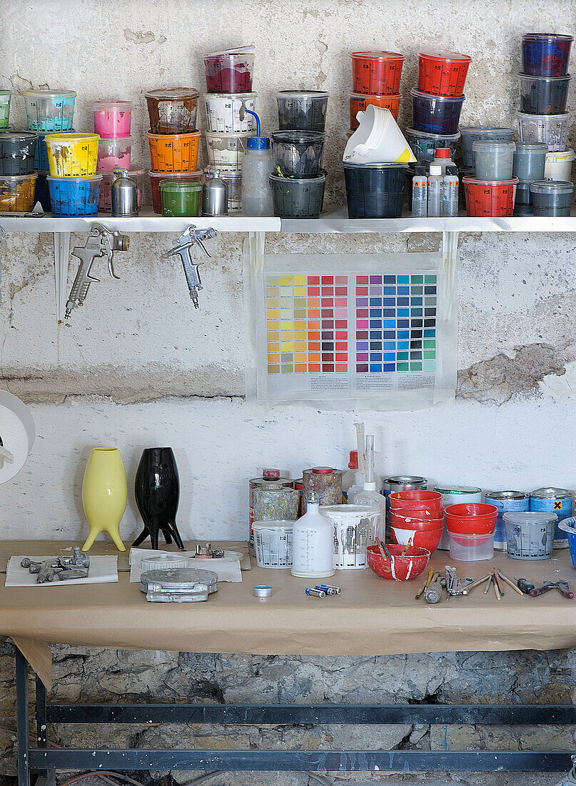 Paint cans in an artist's workshop