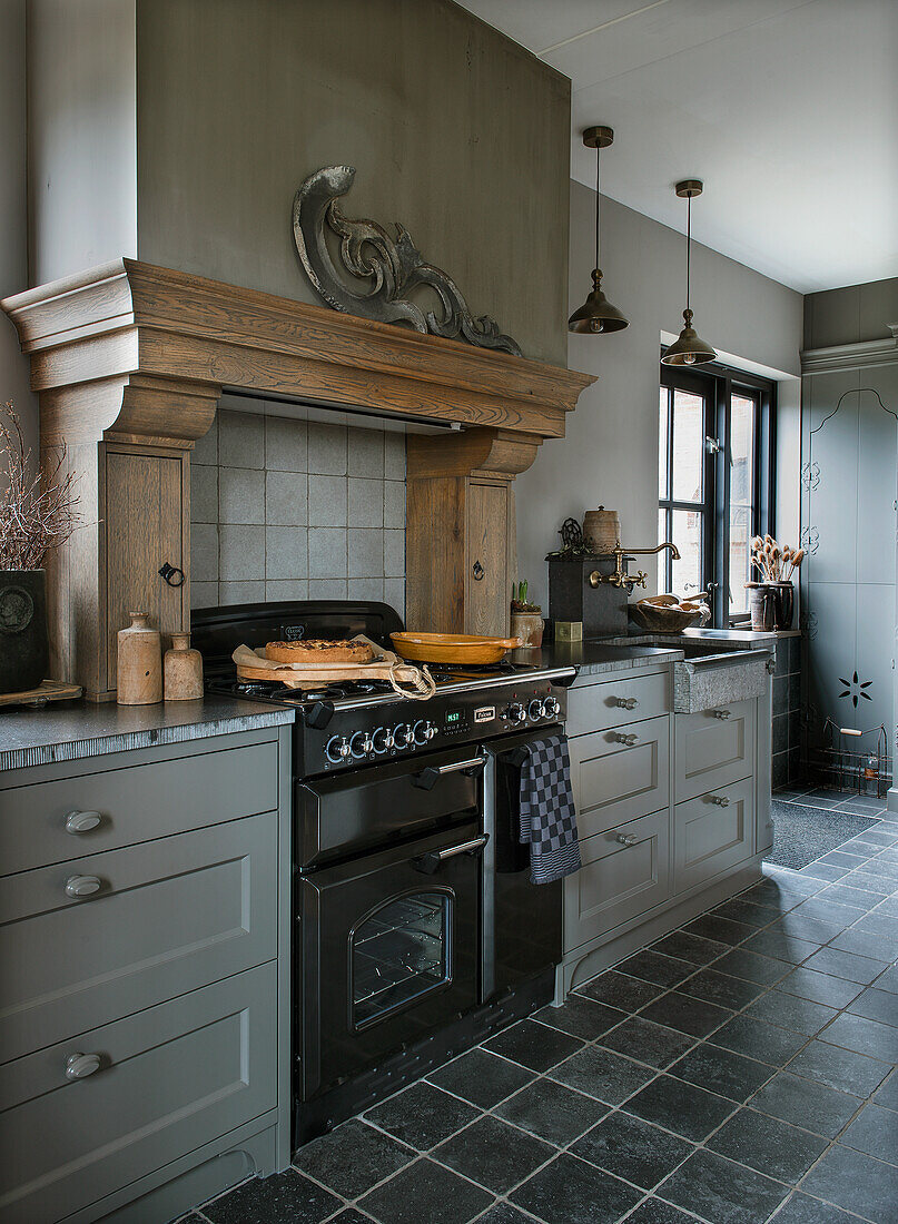 Country-style kitchen with wooden details and grey cabinets