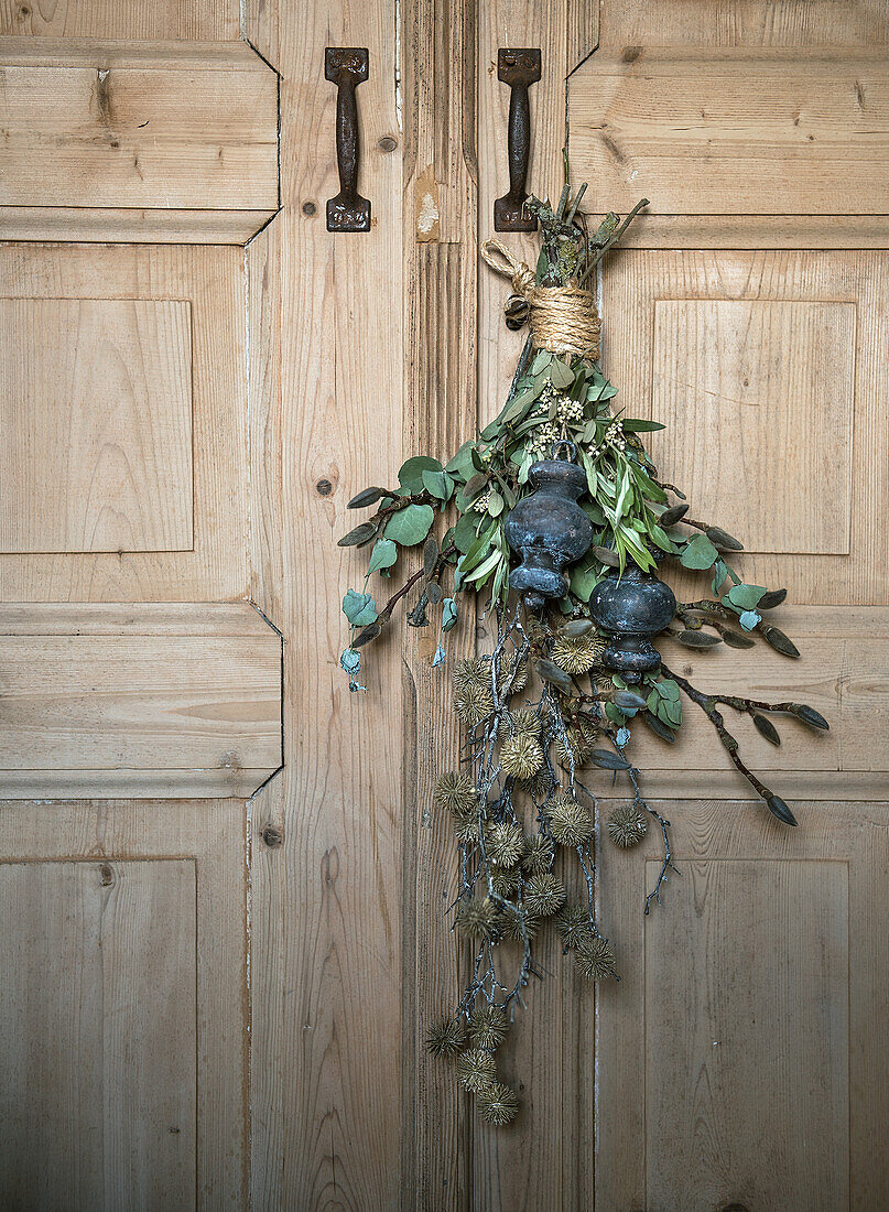 Arrangement of twigs on wooden door