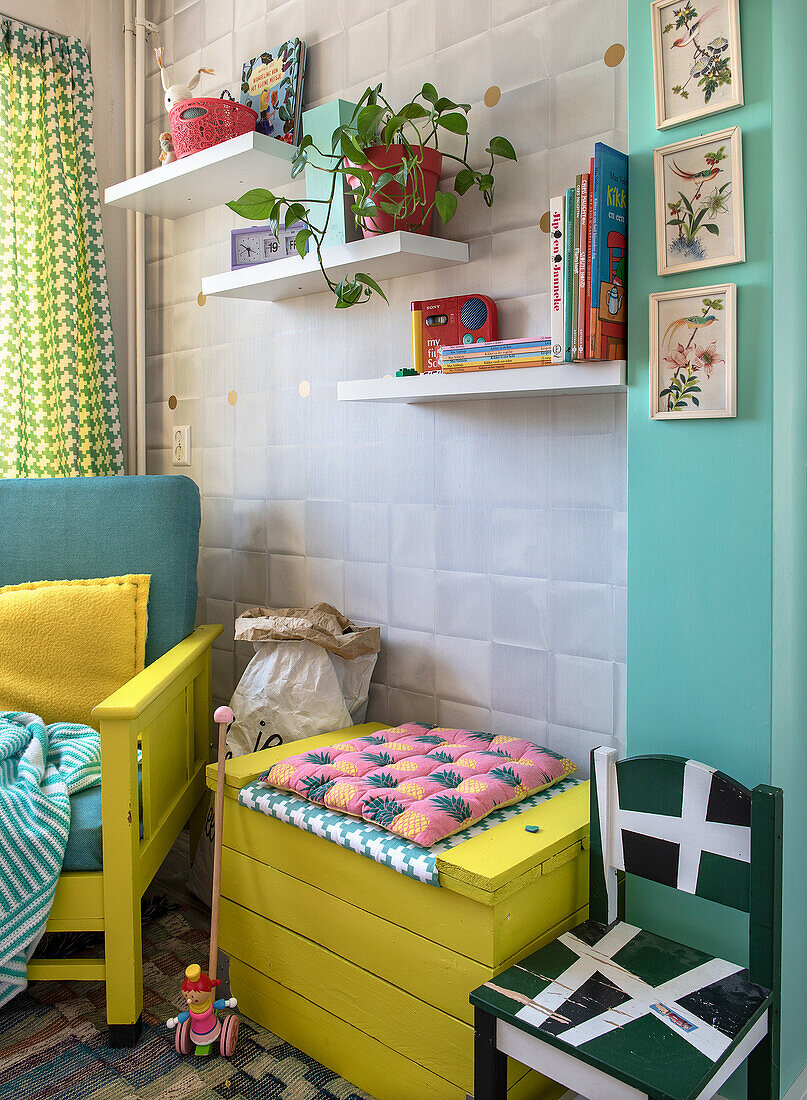 Colourful corner in the children's room with wall shelves