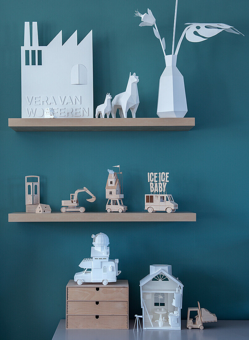 Decorative wooden shelves with miniature models and vases