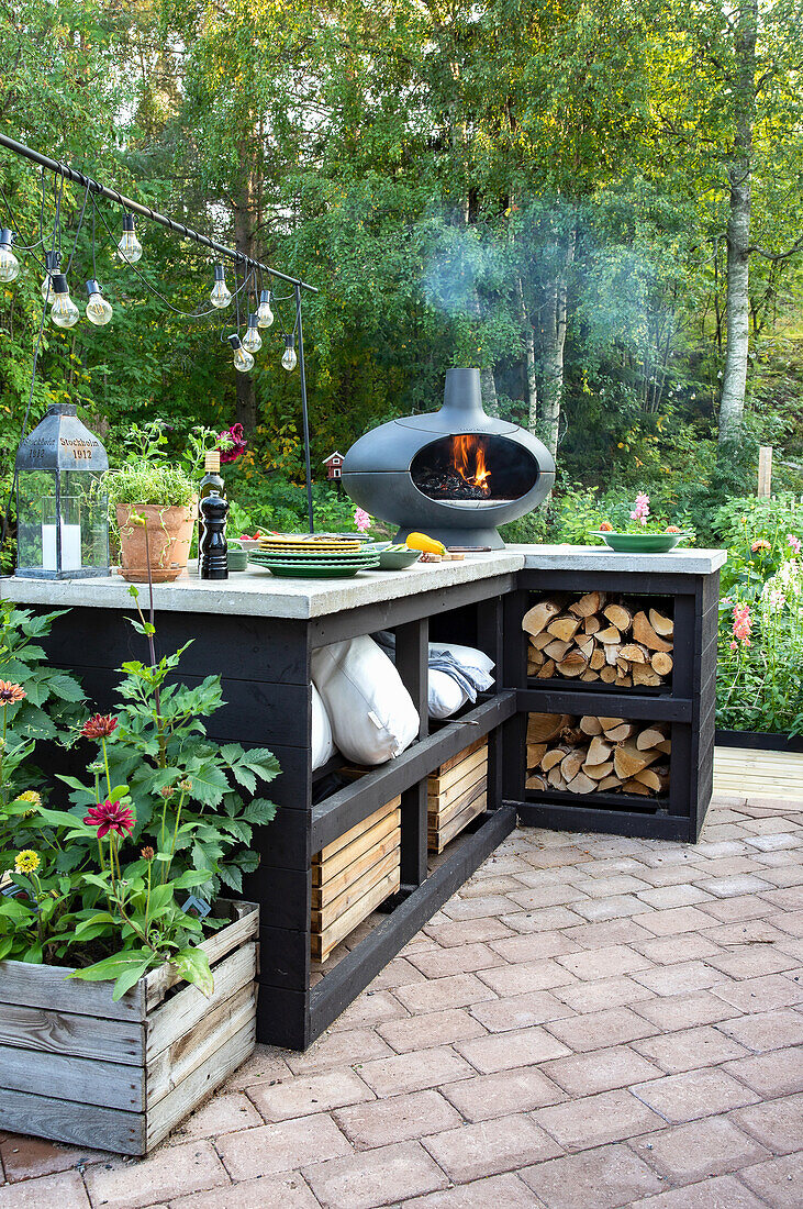 Garden kitchen with fire pit in the countryside