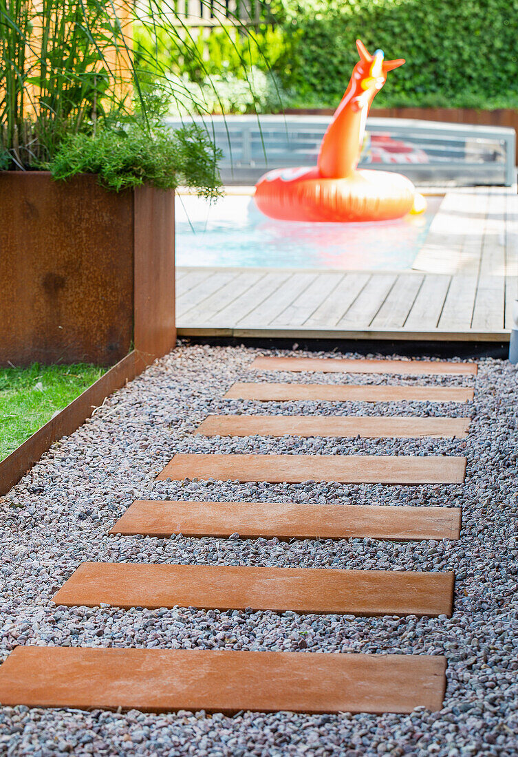 Path to the pool with inflatable toys