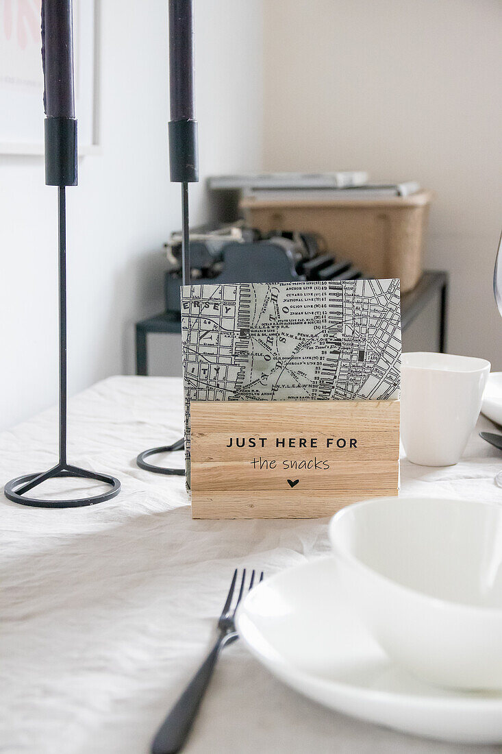 Table decoration with city map napkins and metal candlesticks