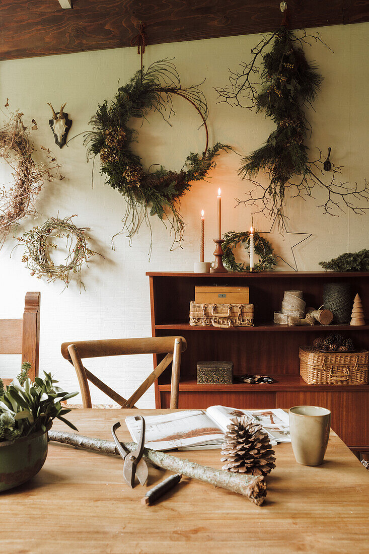 DIY Christmas wreaths made from twigs on the wall in the craft room