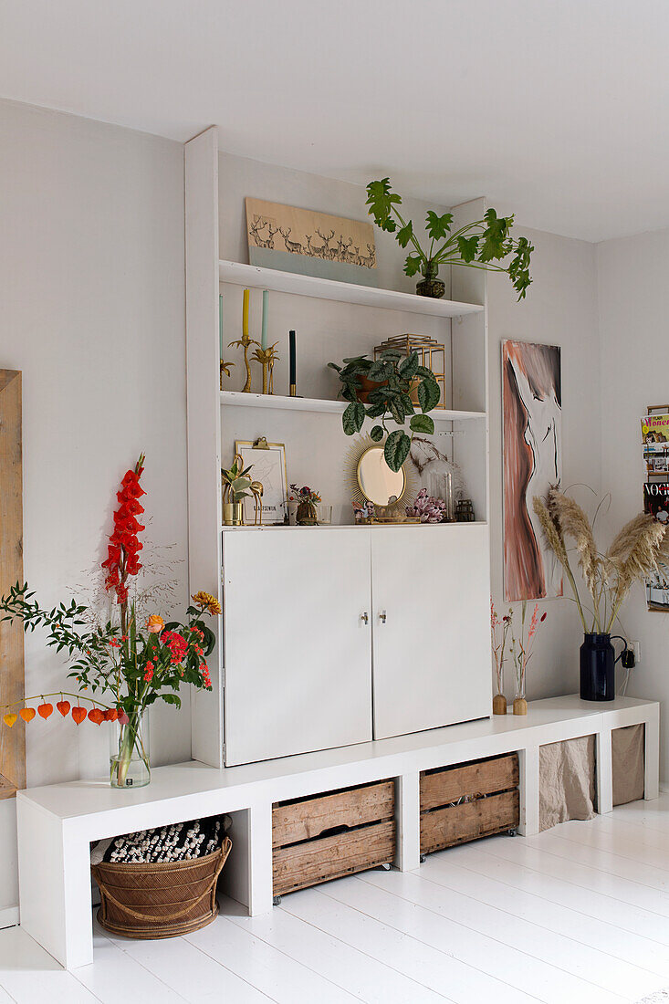 Modern living room wall unit with plants and decoration